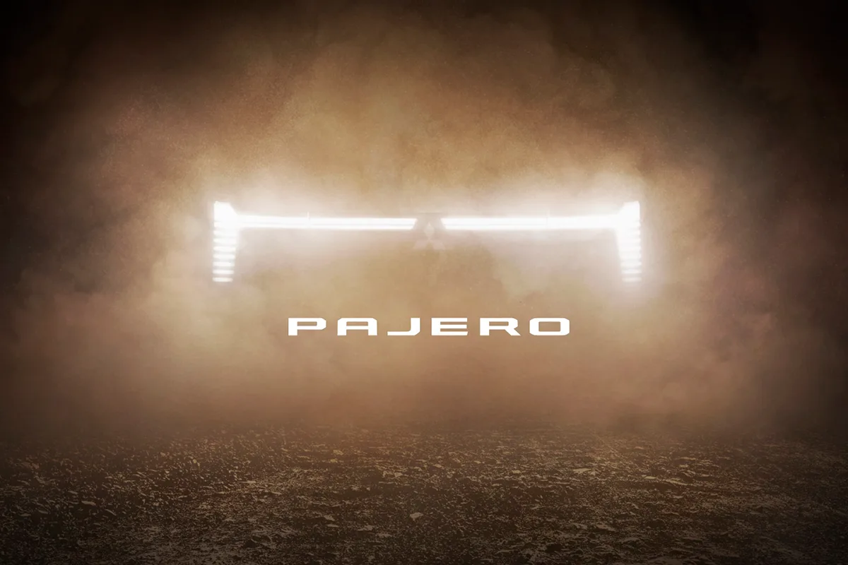 Teaser image of the new Mitsubishi Pajero showing an illuminated front grille.