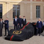 Photo of Demna, Artistic Director of Gucci; Francesca Bellettini, President and CEO of Gucci; Philippe Krief, CEO of Alpine; Pierre Gasly, Alpine Formula One Team driver; Flavio Briatore, Executive Advisor of Alpine Formula One Team; Franco Colapinto, Alpine Formula One Team driver; Luca de Meo, CEO of Kering; François Provost, CEO of Renault Group; François-Henri Pinault, Chairman of the Board of Kering.