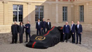 Photo of Demna, Artistic Director of Gucci; Francesca Bellettini, President and CEO of Gucci; Philippe Krief, CEO of Alpine; Pierre Gasly, Alpine Formula One Team driver; Flavio Briatore, Executive Advisor of Alpine Formula One Team; Franco Colapinto, Alpine Formula One Team driver; Luca de Meo, CEO of Kering; François Provost, CEO of Renault Group; François-Henri Pinault, Chairman of the Board of Kering.