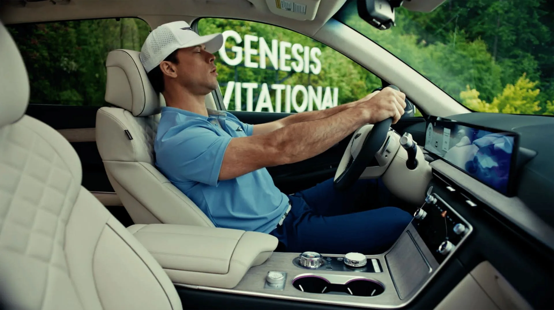 A photo of Jimmy Tatro sitting inside a Genesis GV80 in a scene from Netflix's 'The Hawk' series.