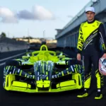 Mitch Evans posing with the Opel GSE Formula E racecar.