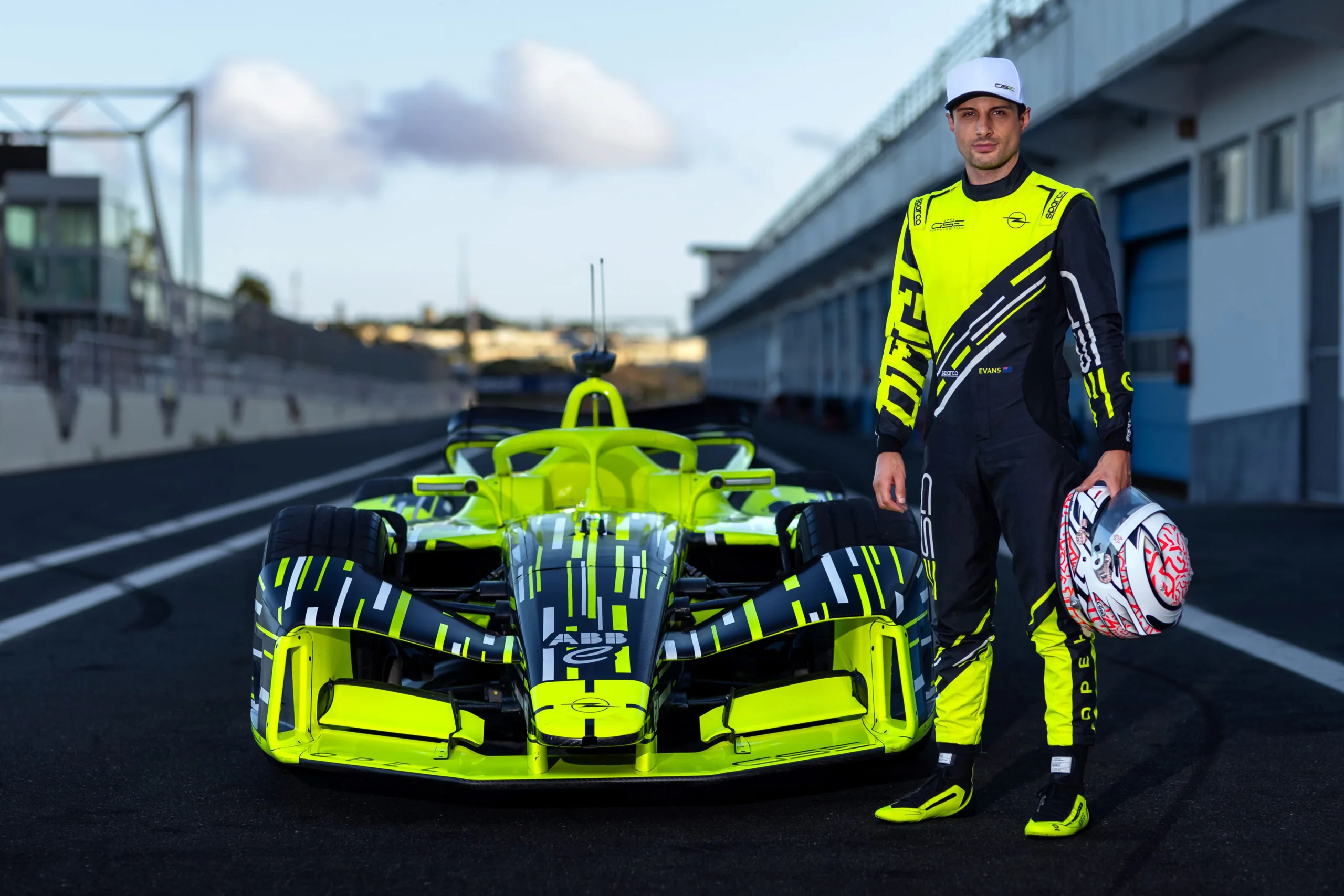 Mitch Evans posing with the Opel GSE Formula E racecar.
