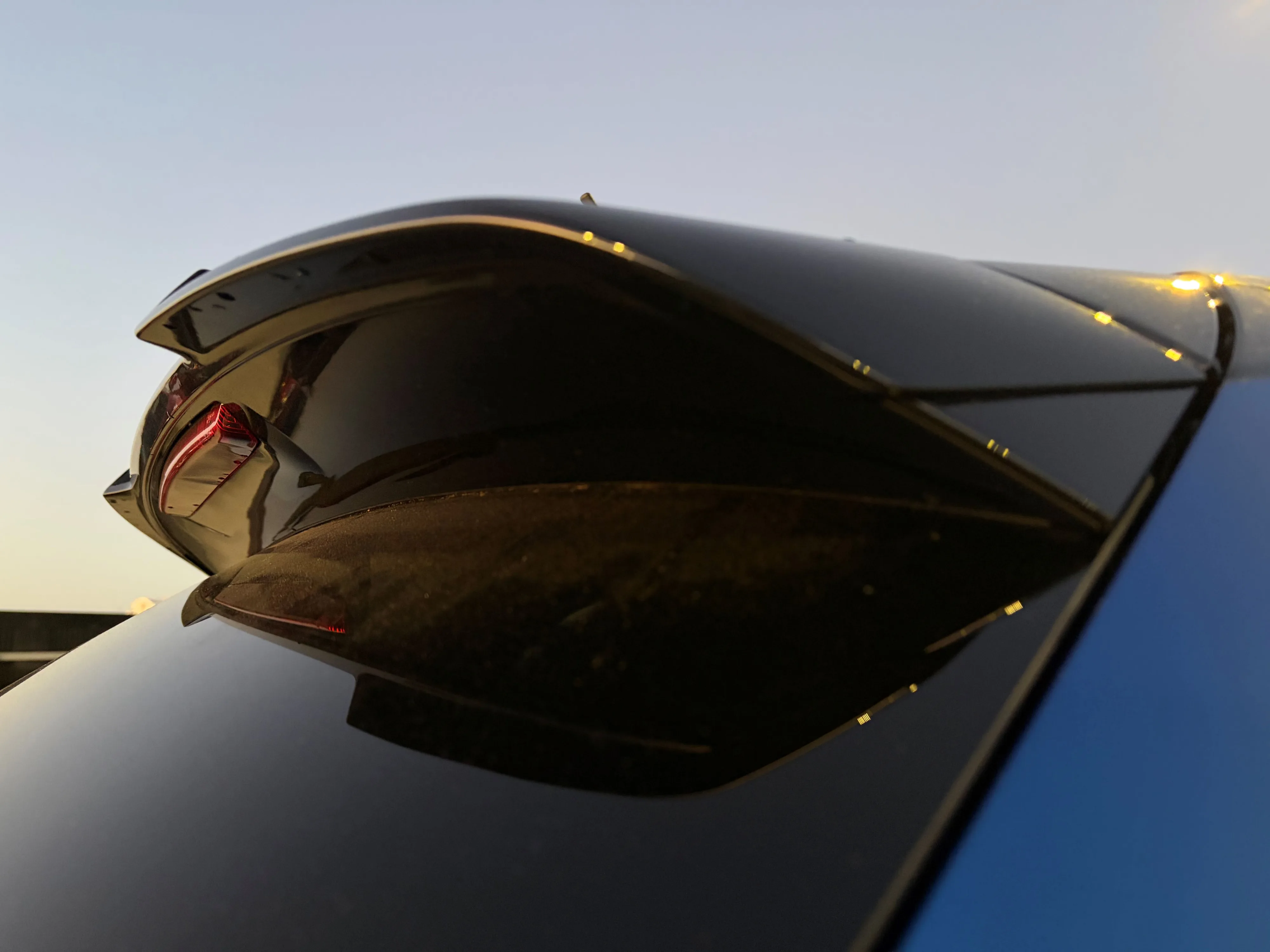 Close-up of the rear lip spoiler of a 2026 Skoda Fabia 130 in Race Blue Metallic with a Black Magic Pearl contrast roof.