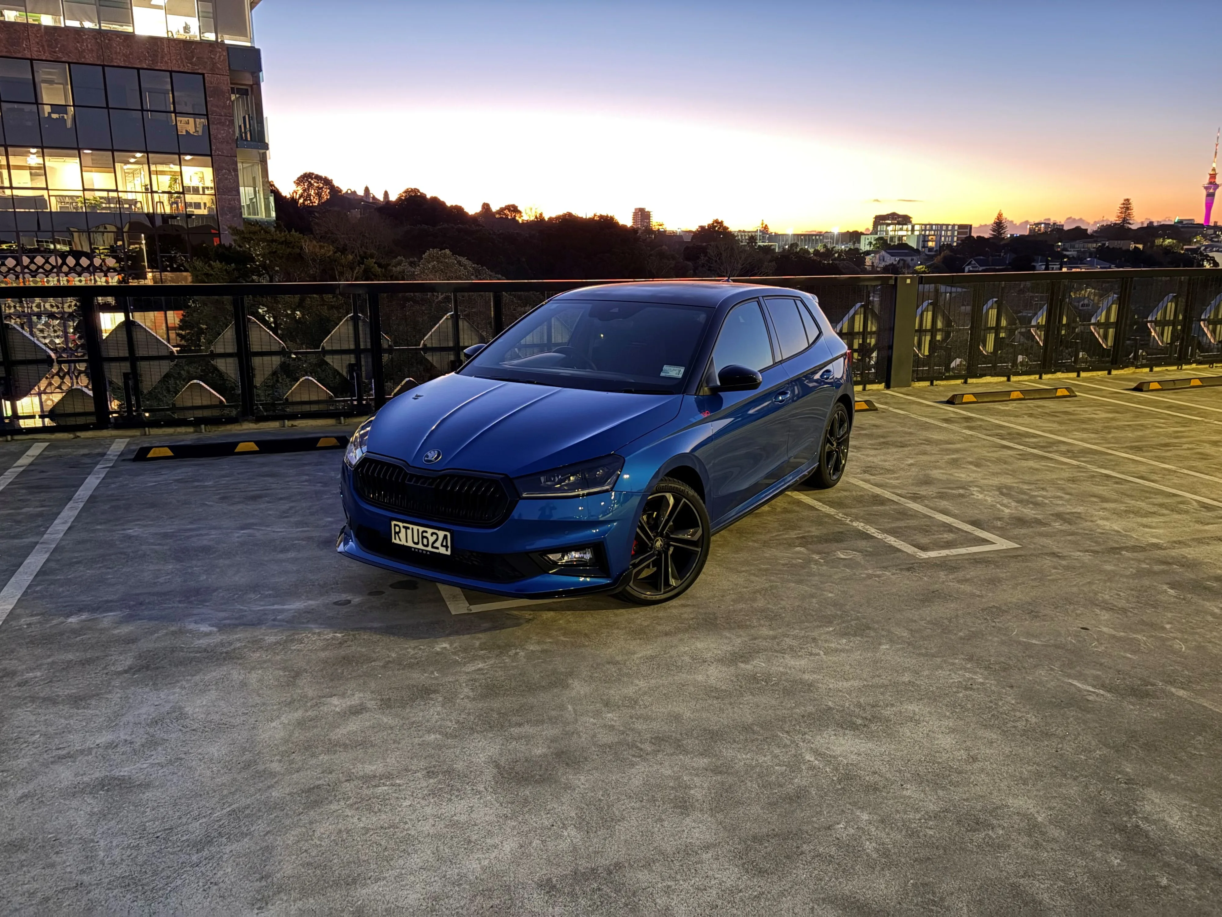 Front three quarters view of a 2026 Skoda Fabia 130 in Race Blue Metallic with a Black Magic Pearl roof.