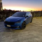 Front three quarters view of a 2026 Skoda Fabia 130 in Race Blue Metallic with a Black Magic Pearl roof.
