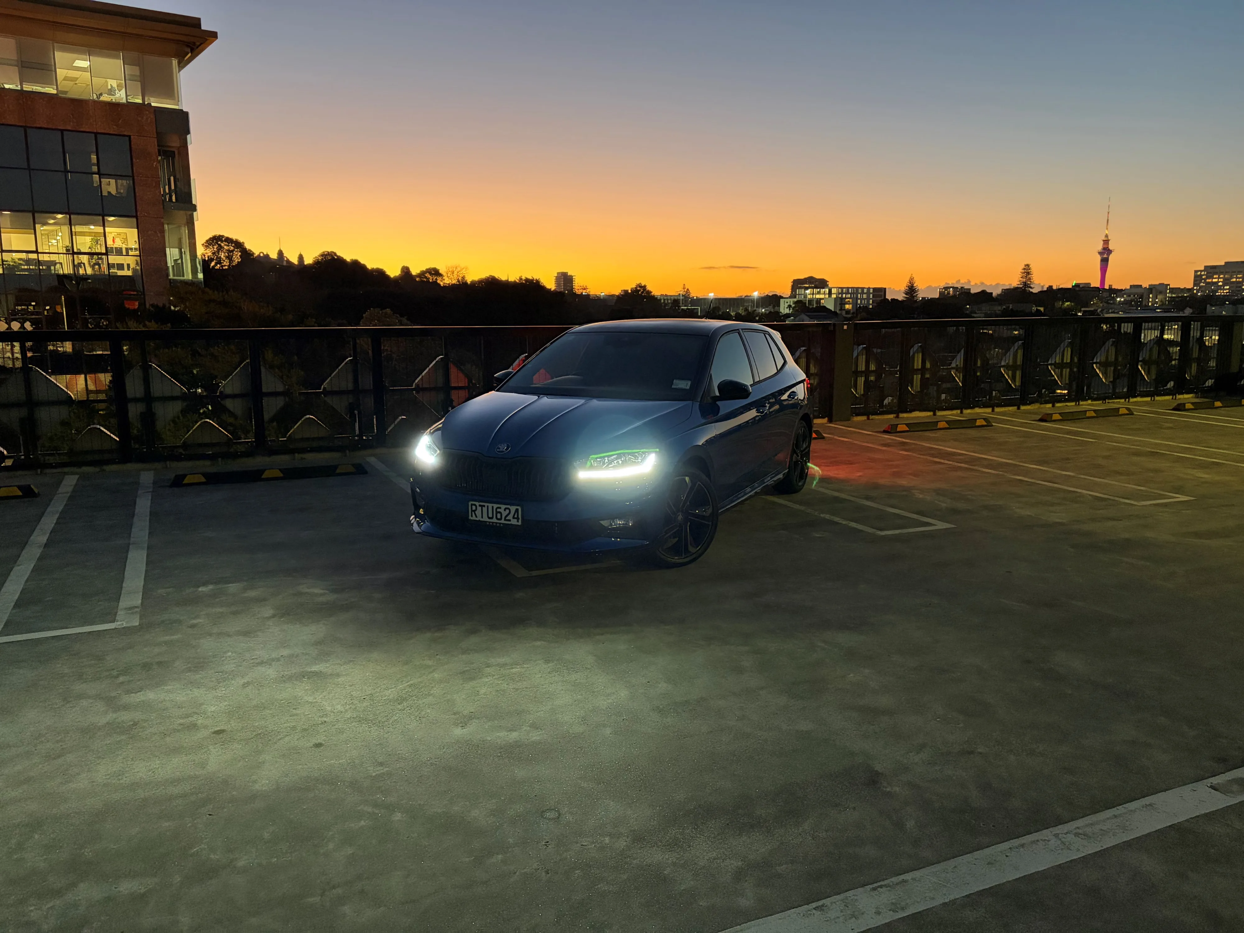 Front three quarters view of a 2026 Skoda Fabia 130 in Race Blue Metallic with a Black Magic Pearl roof.