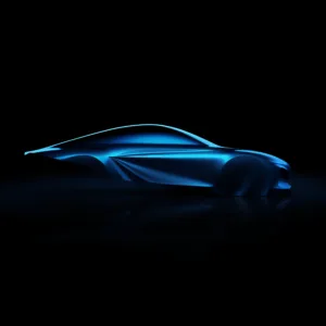Side on view of a sculpture of the third generation Alpine A110.