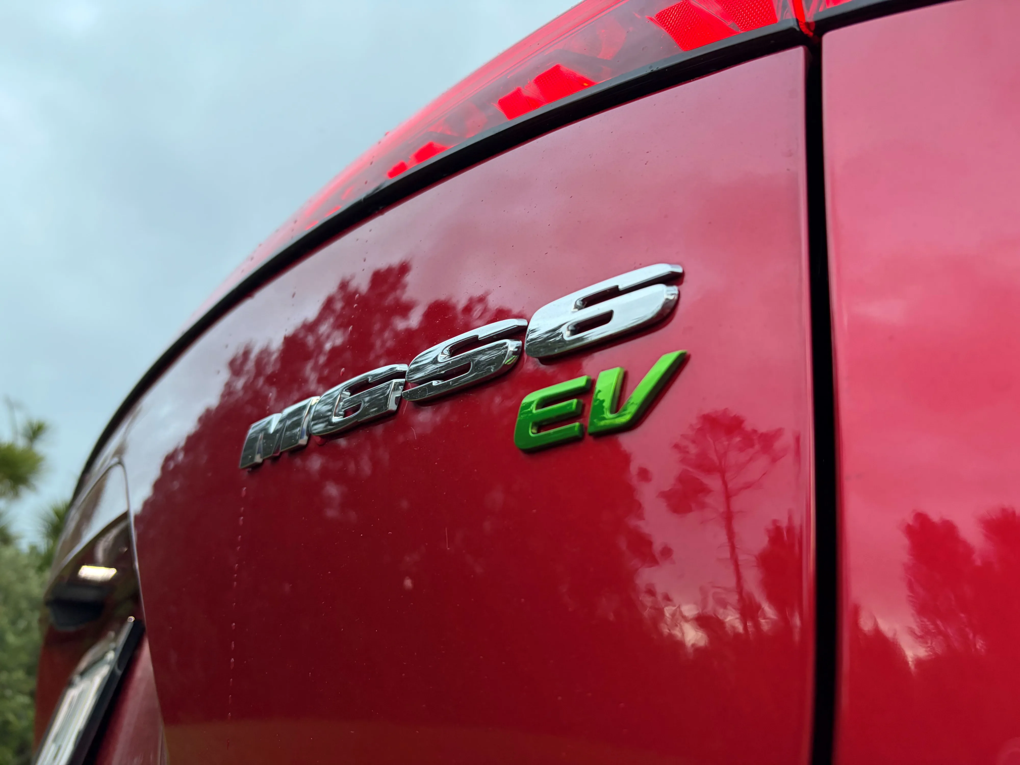 Close-up of the rear badges on a 2026 MG S6 EV in Diamond Red.