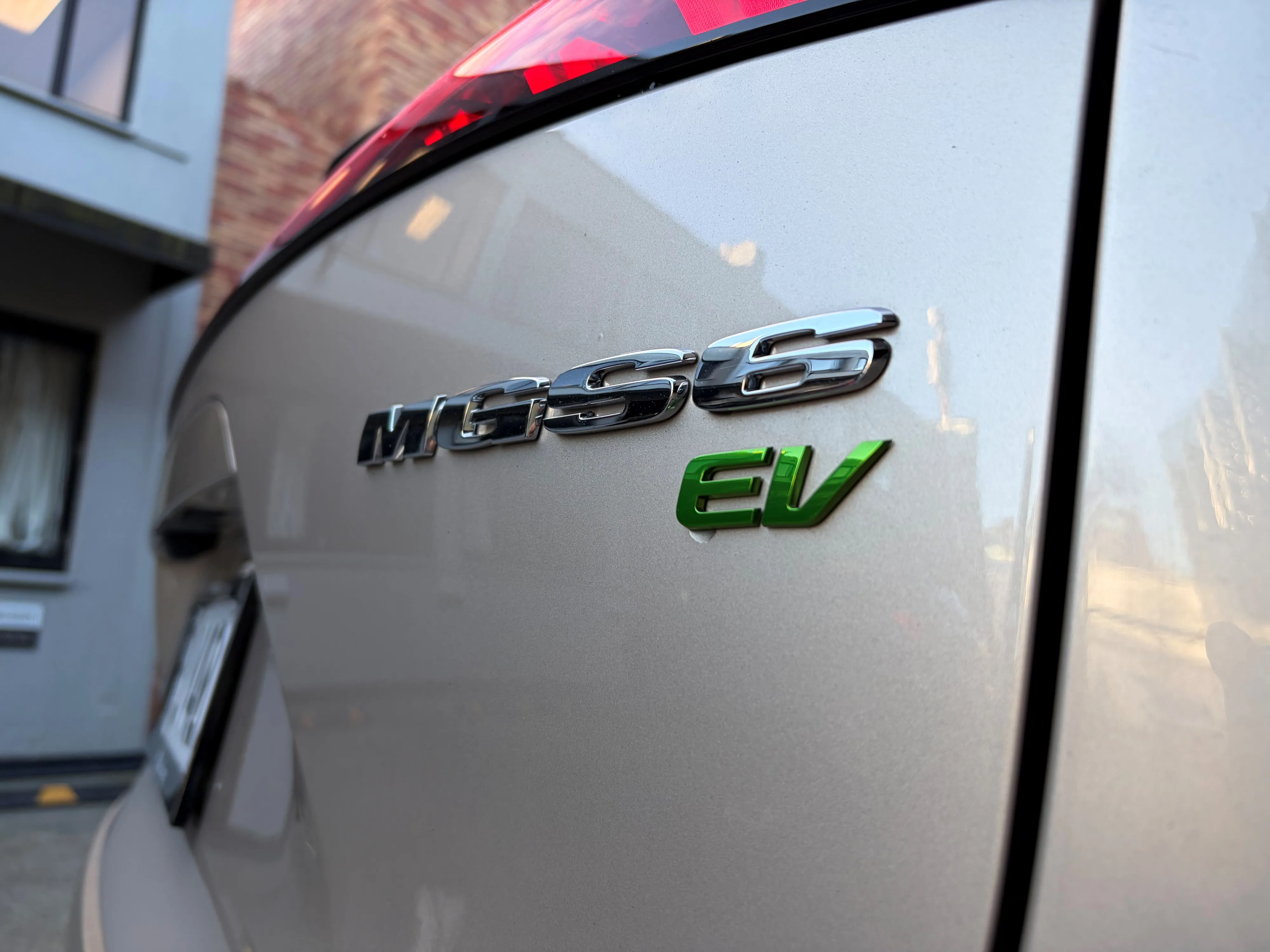 Close-up of the rear badges on a 2026 MG S6 EV in Stratford Gold.