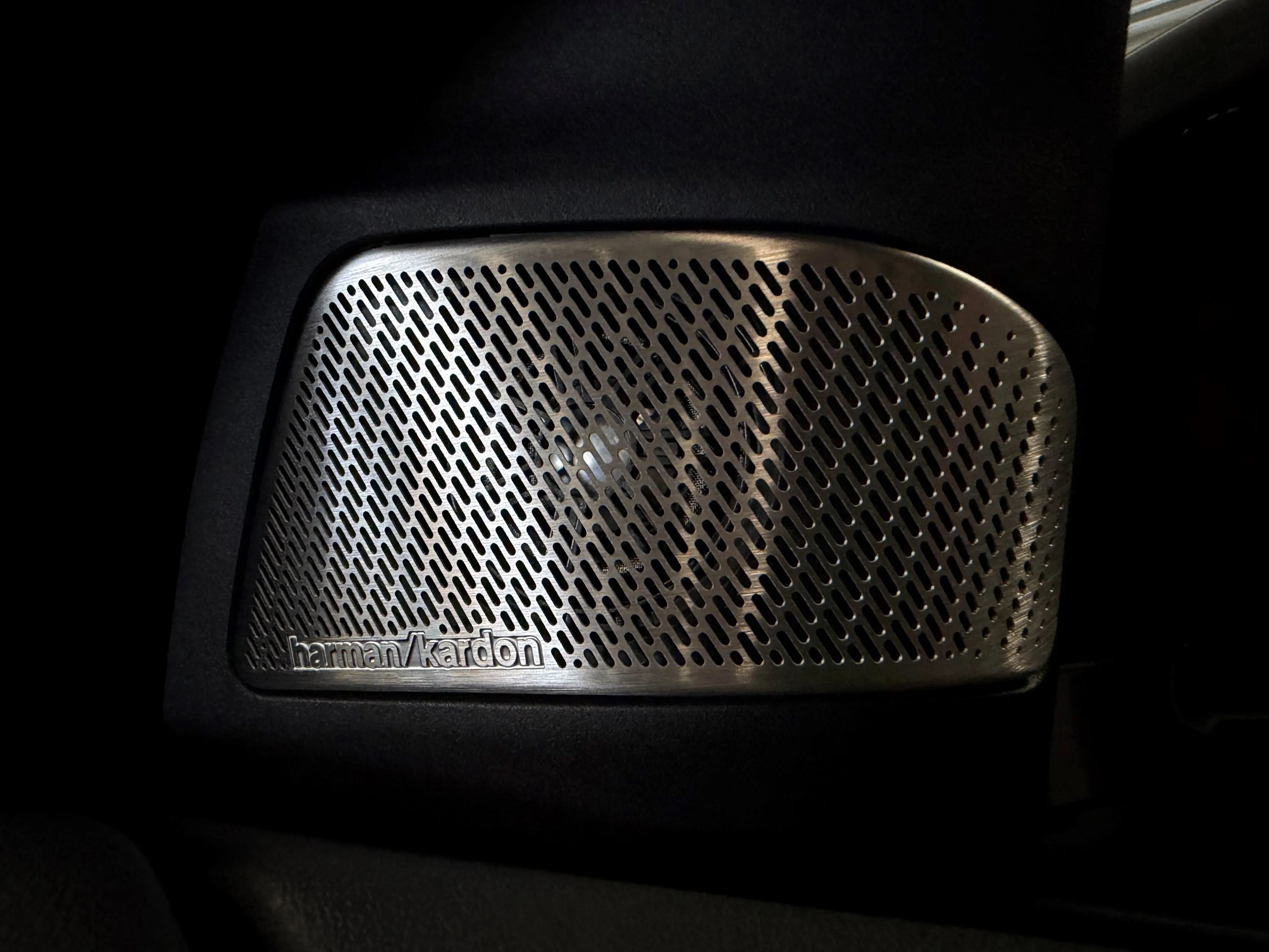 Close up of the Harman Kardon branded tweeter housings on the interior of a 2026 BMW iX3 50.