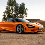 Front three quarters view of a McLaren 750S in Papaya Orange.
