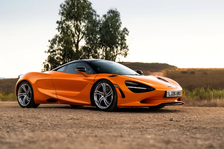 Front three quarters view of a McLaren 750S in Papaya Orange.