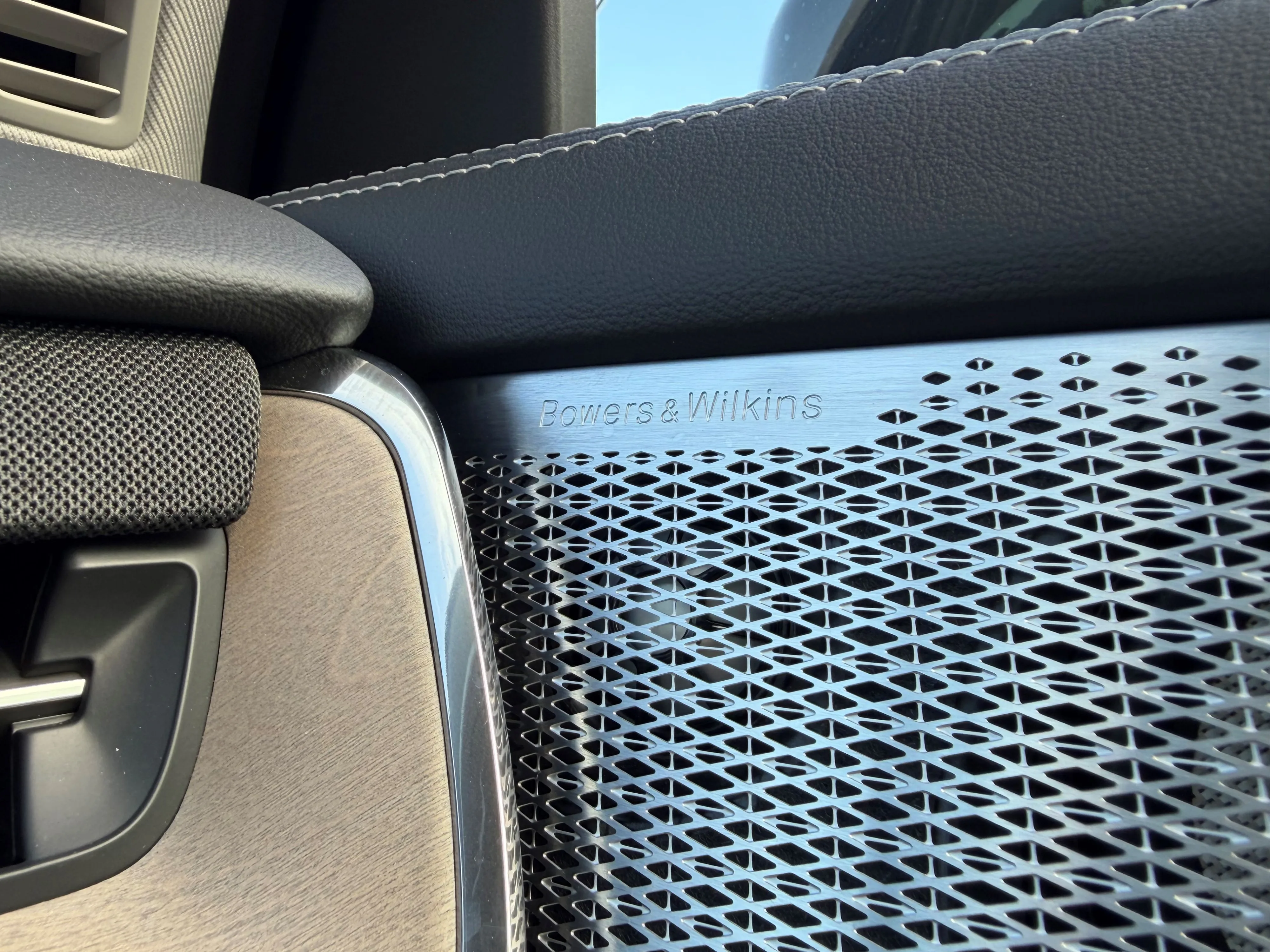 Close up of the Bowers & Wilkins branded speakers on the inside of a 2026 Volvo EX90 Ultra Twin Motor Performance in Sand Dune.